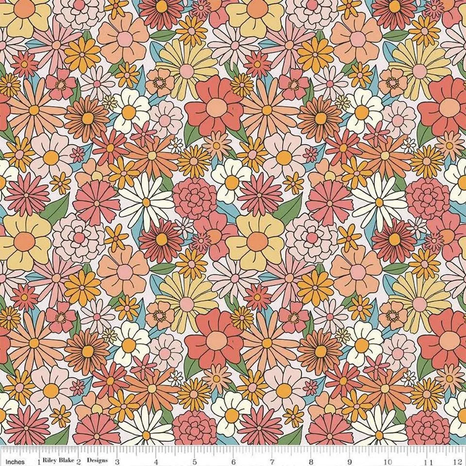 Colorful floral pattern with a fabric ruler at the bottom