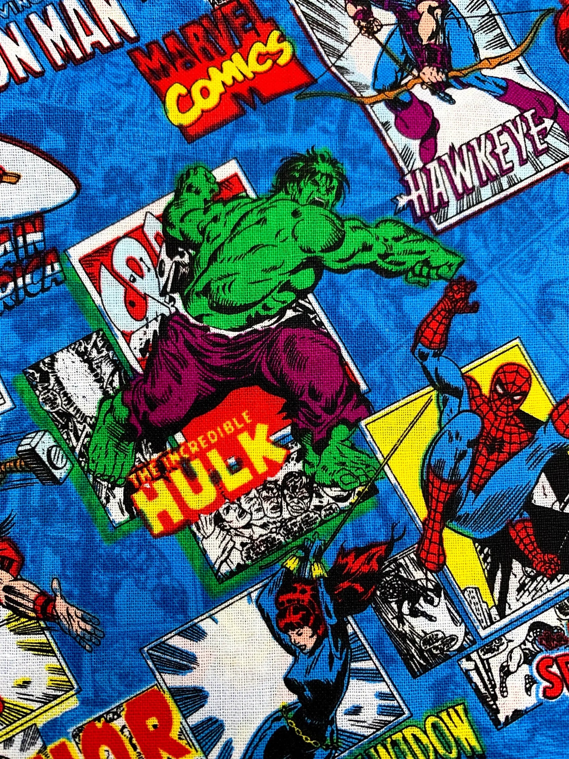 Marvel Comics fabric with superhero characters and logos on a blue background