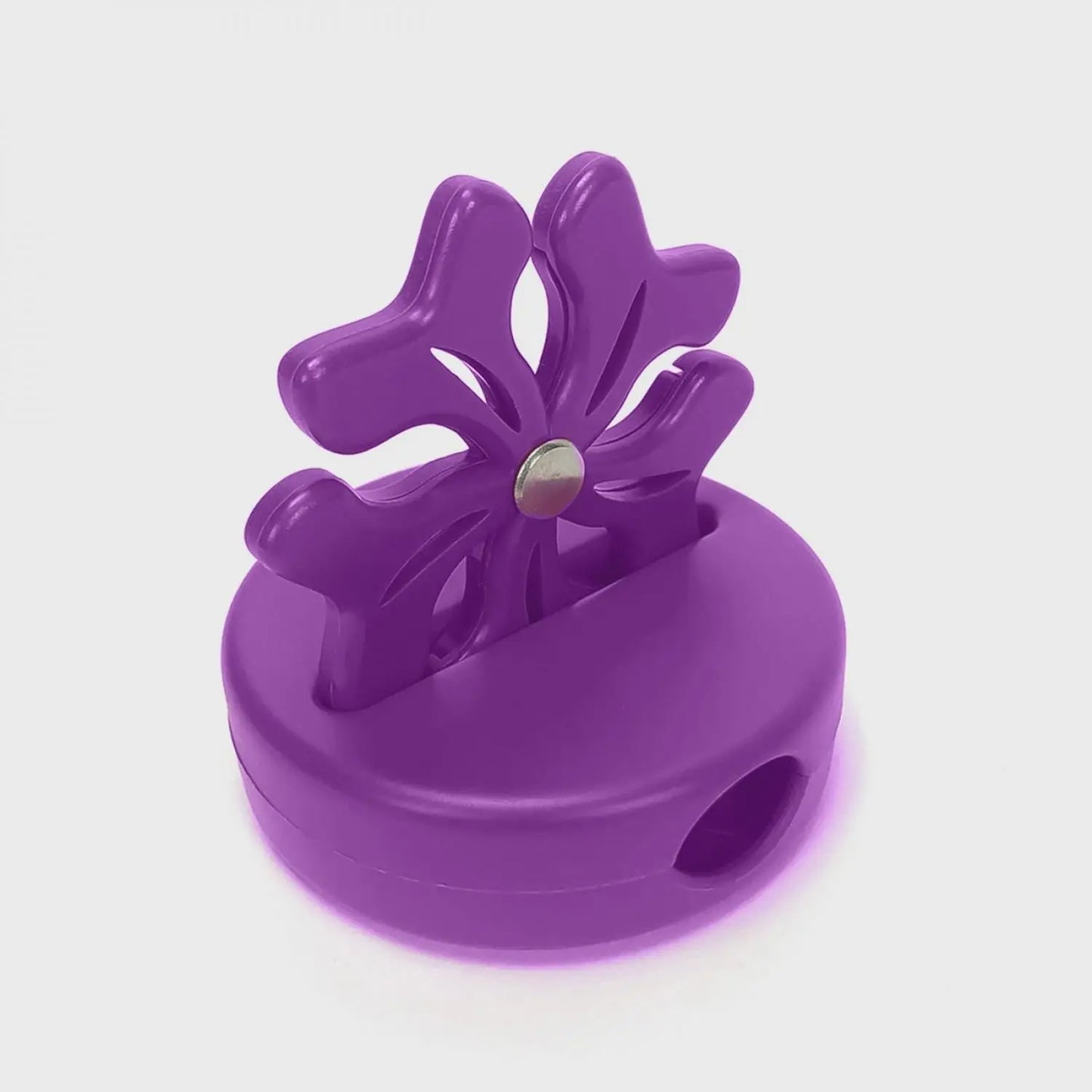 Purple flower-shaped thread cutter on a white background
