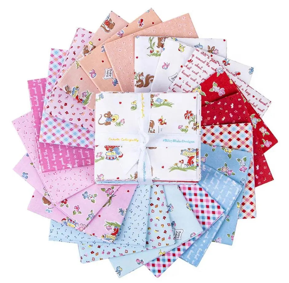 Collection of colorful fabric fat quarters with various patterns on a white background