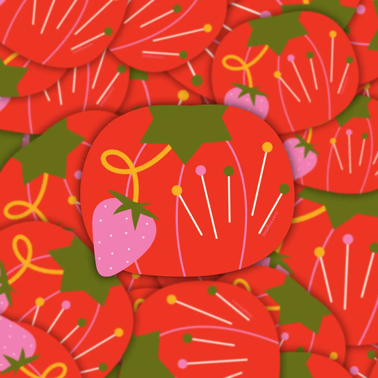 Pattern of red tomato pin cushion with pink strawberry