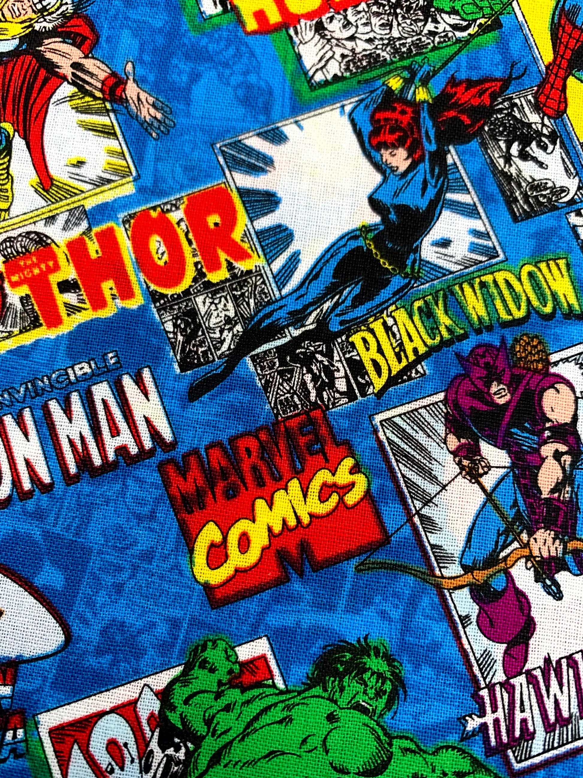 Marvel Comics fabric with superhero characters and text on a blue background