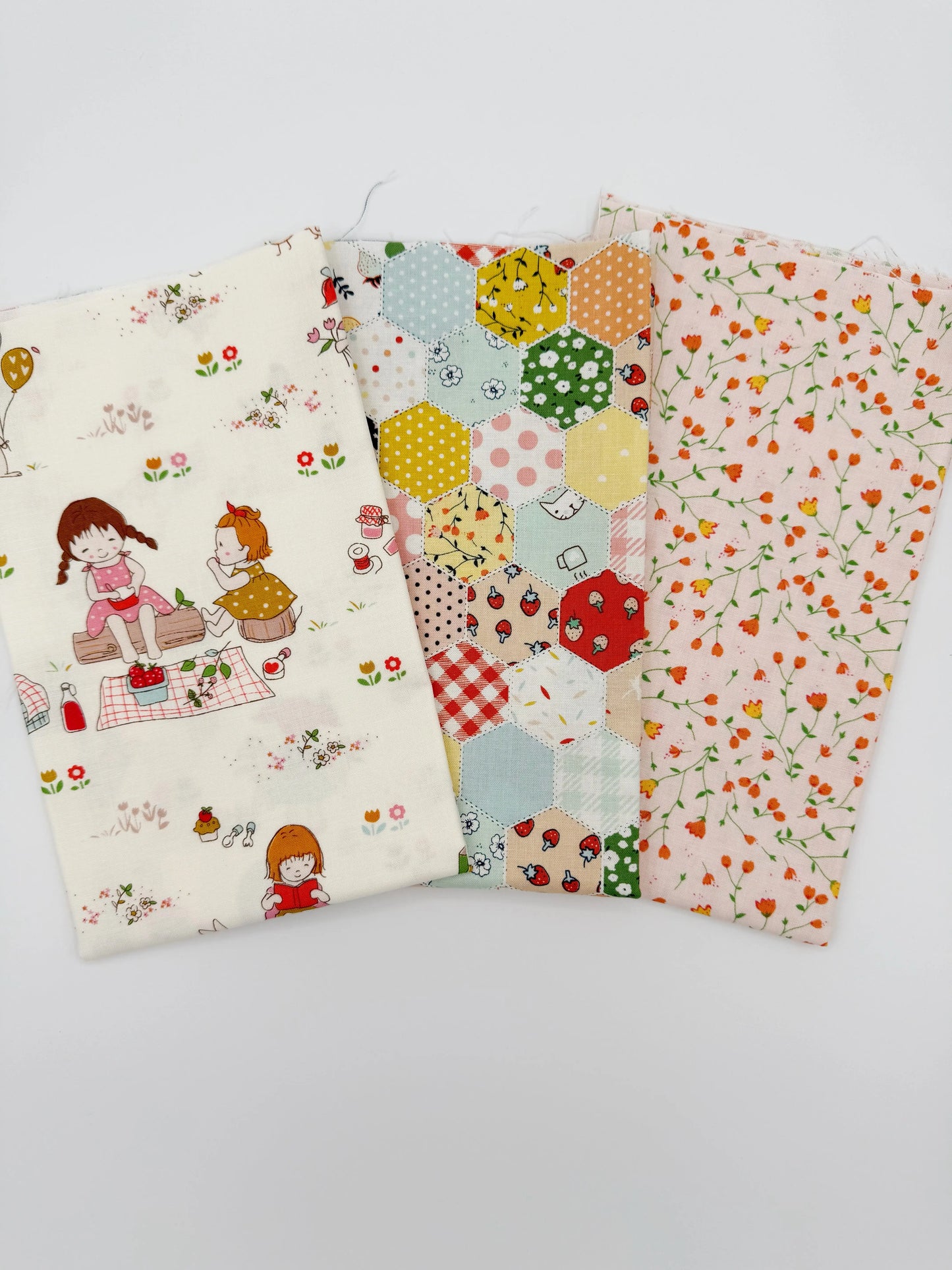 Three fabric swatches with different patterns on a white background