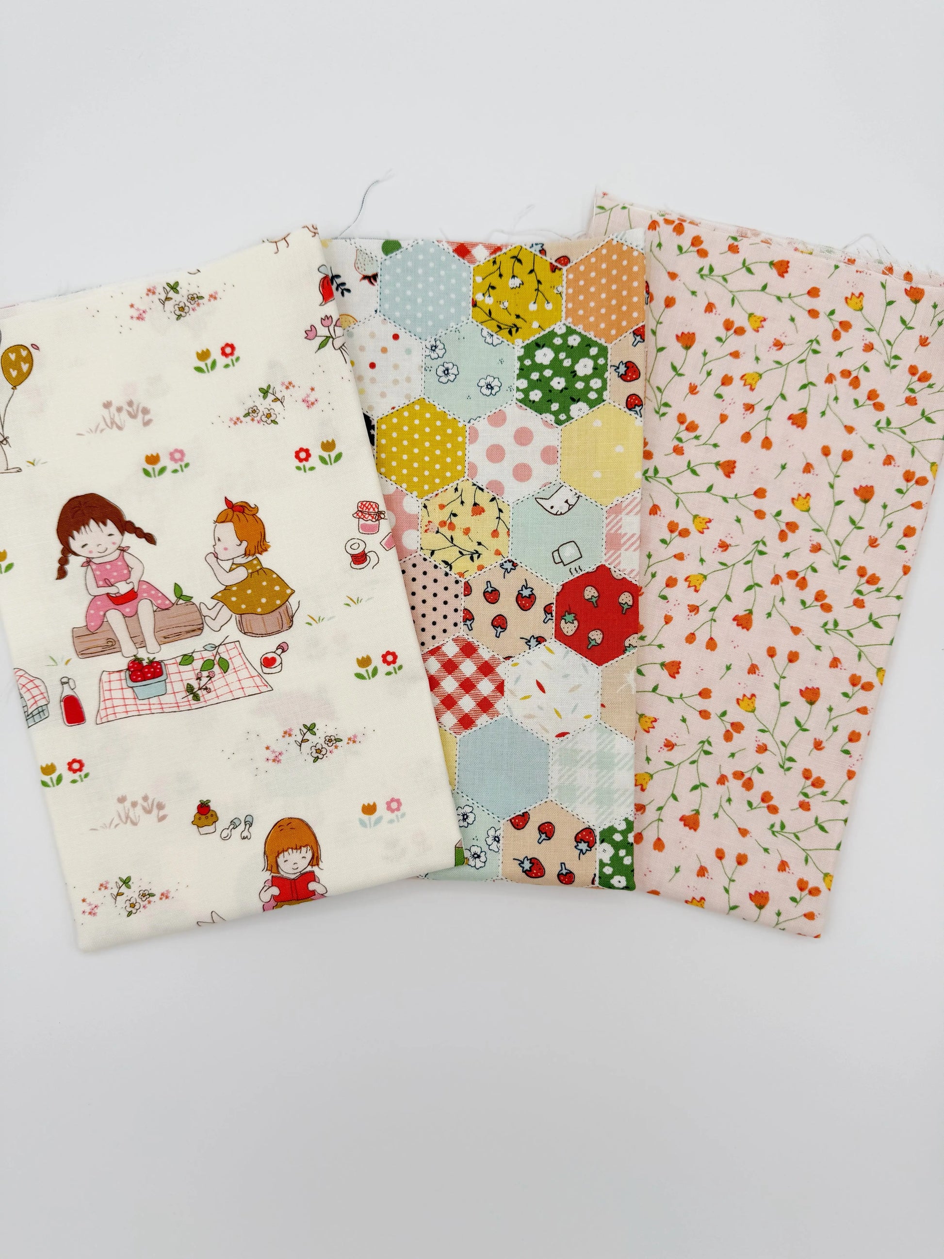 Three fabric swatches with different patterns on a white background