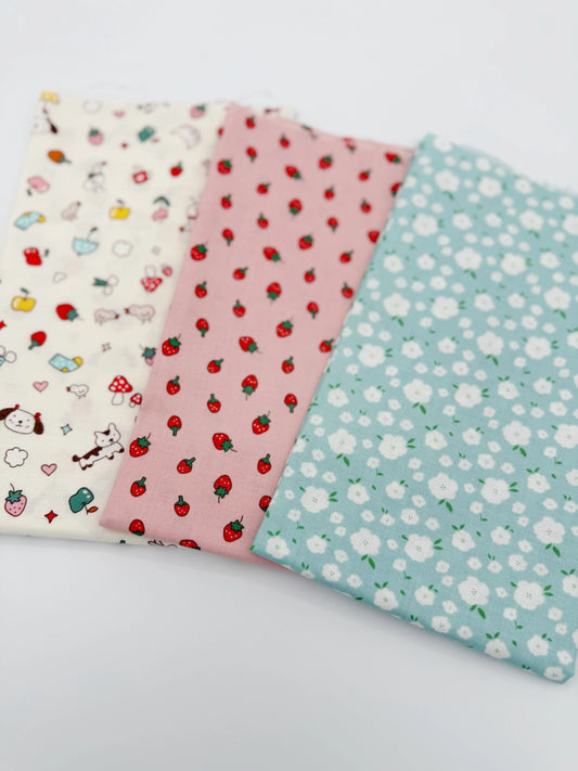 Three fabric swatches with different patterns on a white background