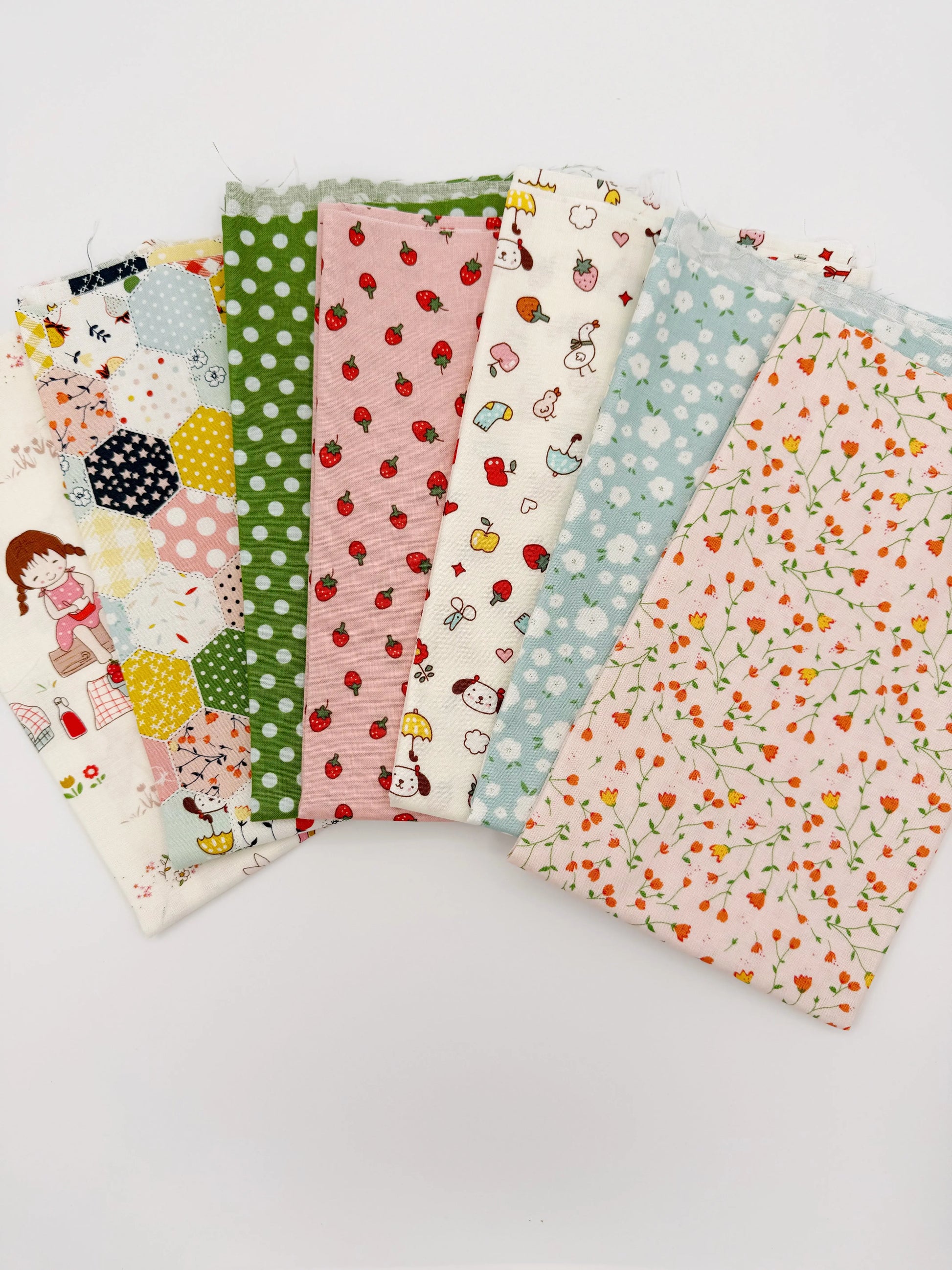 Set of colorful fabric swatches with various patterns on a light gray background