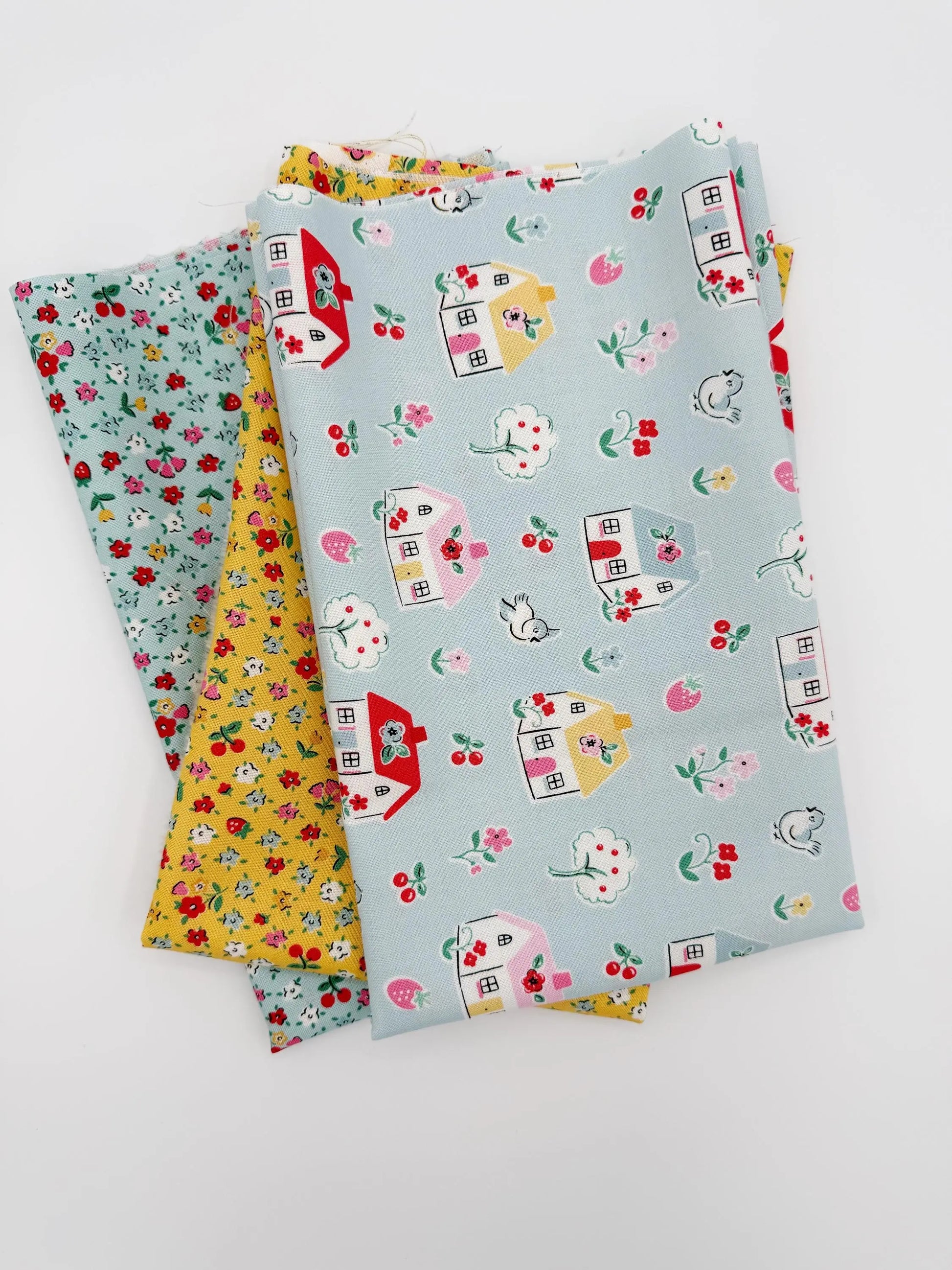 Three fabric swatches with different patterns on a white background