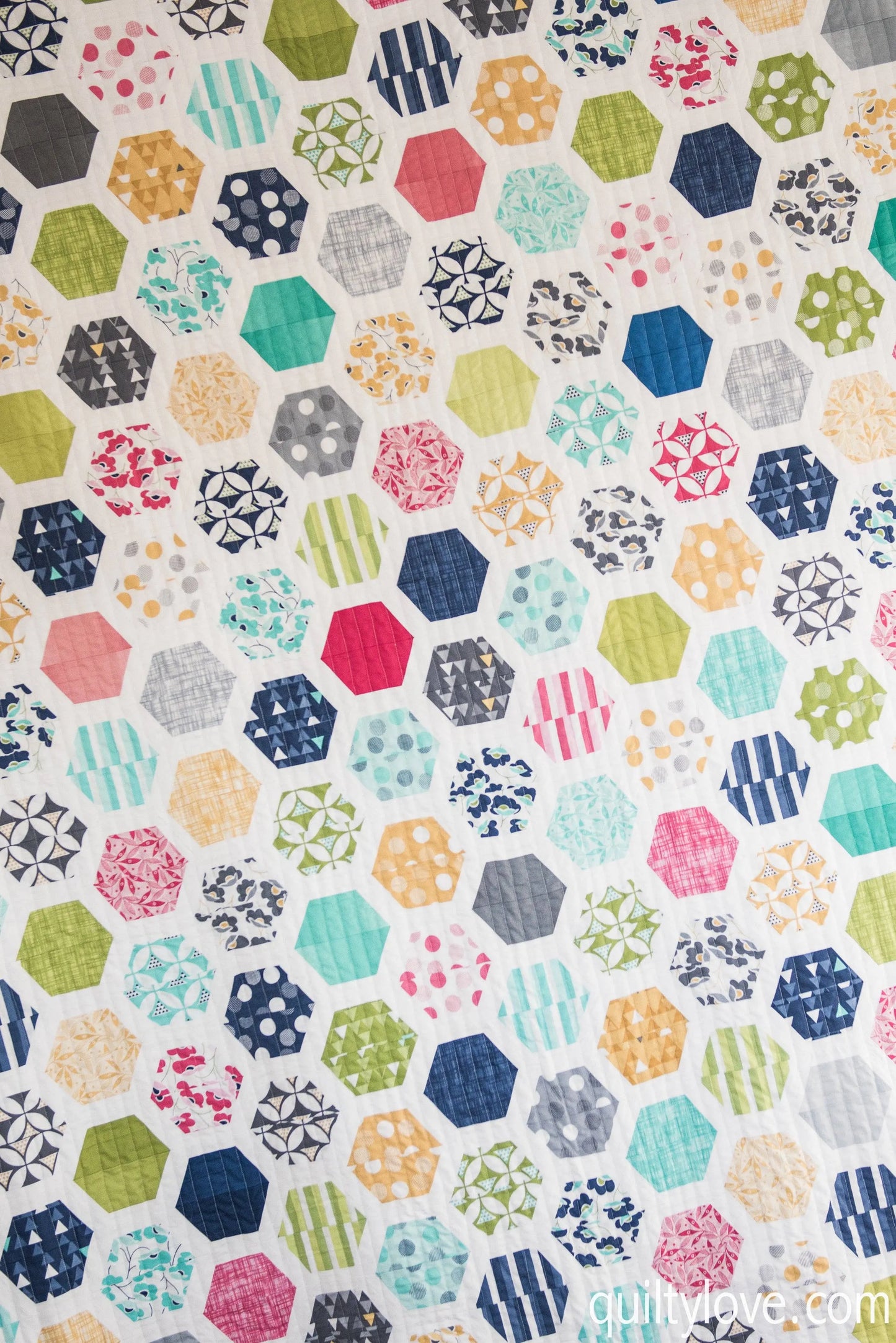 Patterned fabric with colorful geometric shapes on a white background