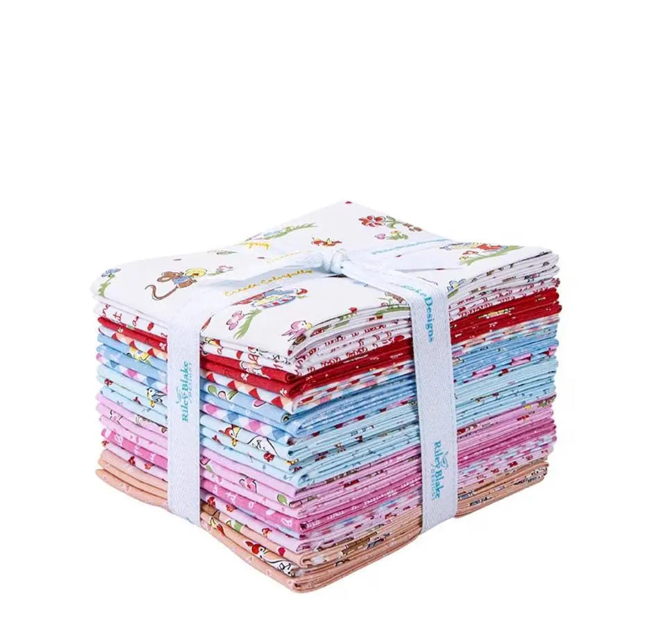 Stack of colorful fabric bundles tied together on a white background